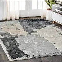 Photo of Beige and Black Abstract Distressed Area Rug