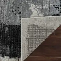 Photo of Beige and Black Abstract Distressed Area Rug