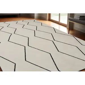 Photo of Beige and Black Geometric Power Loom Distressed Area Rug