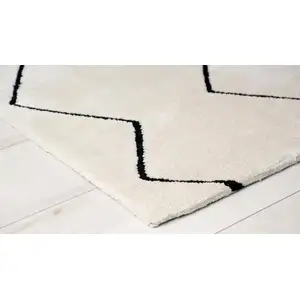 Photo of Beige and Black Geometric Power Loom Distressed Area Rug