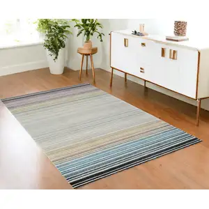 Photo of Beige and Blue Abstract Distressed Area Rug