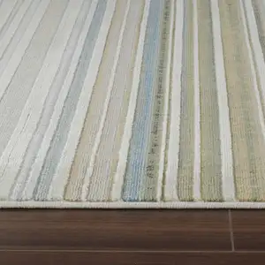 Photo of Beige and Blue Abstract Distressed Area Rug