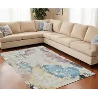 Photo of Beige and Blue Abstract Distressed Area Rug