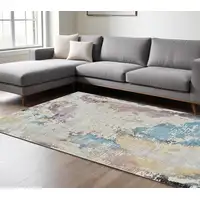 Photo of Beige and Blue Abstract Distressed Area Rug