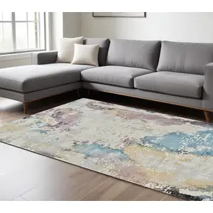 Photo of Beige and Blue Abstract Distressed Area Rug