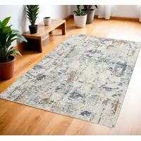 Photo of Beige and Blue Abstract Power Loom Area Rug