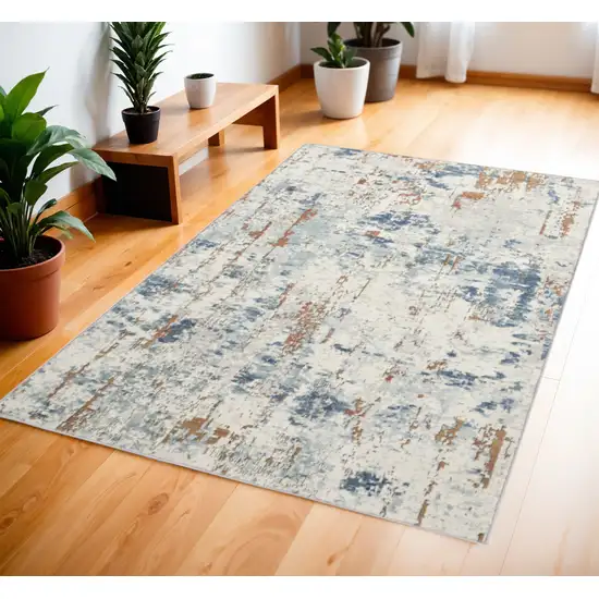 Beige and Blue Abstract Power Loom Area Rug Photo 1