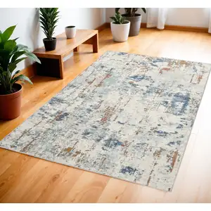 Photo of Beige and Blue Abstract Power Loom Area Rug