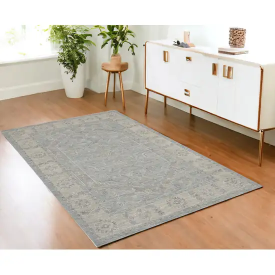 Beige and Blue Floral Power Loom Area Rug Photo 1