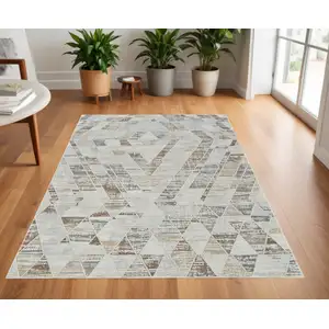 Photo of Beige and Brown Abstract Distressed Area Rug