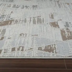 Photo of Beige and Brown Abstract Distressed Area Rug