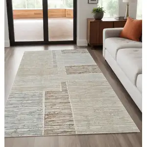 Photo of Beige and Brown Abstract Distressed Area Rug