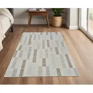 Photo of Beige and Brown Abstract Distressed Area Rug