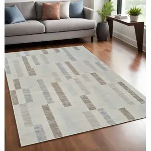 Photo of Beige and Brown Abstract Distressed Area Rug