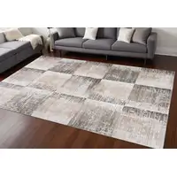 Photo of Beige and Brown Abstract Distressed Area Rug