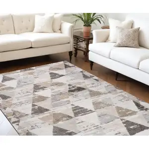 Photo of Beige and Brown Abstract Distressed Area Rug