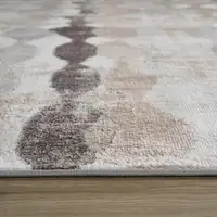 Photo of Beige and Brown Abstract Distressed Area Rug