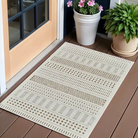 Beige and Brown Geometric Distressed Indoor Outdoor Area Rug Photo 1