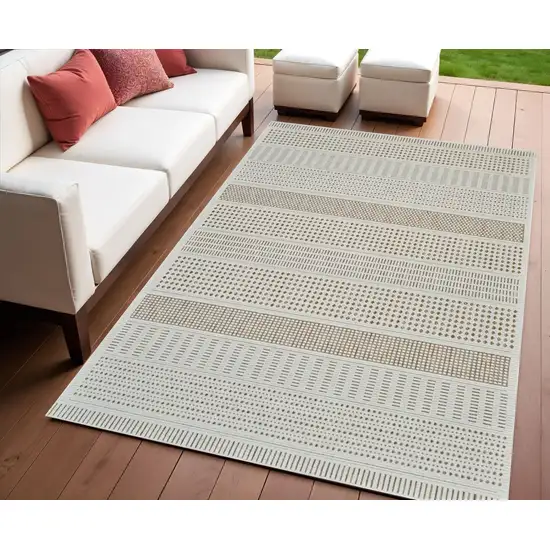 Beige and Brown Geometric Distressed Indoor Outdoor Area Rug Photo 1