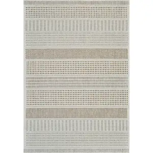 Photo of Beige and Brown Geometric Distressed Indoor Outdoor Area Rug