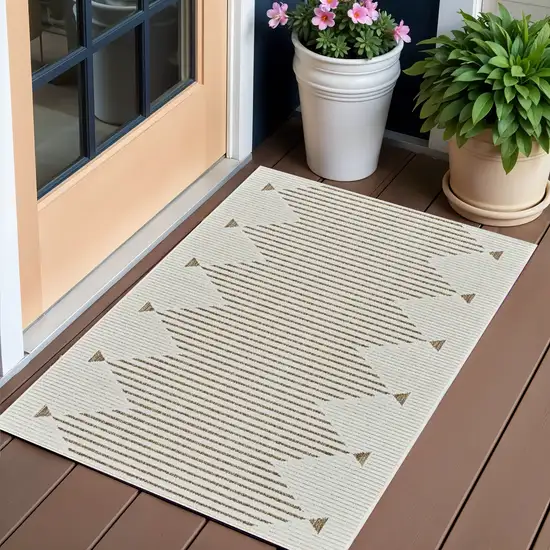 Beige and Brown Geometric Distressed Indoor Outdoor Area Rug Photo 1