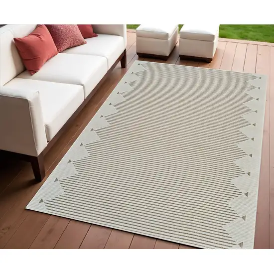 Beige and Brown Geometric Distressed Indoor Outdoor Area Rug Photo 1