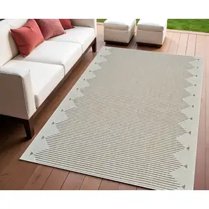 Photo of Beige and Brown Geometric Distressed Indoor Outdoor Area Rug