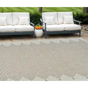 Photo of Beige and Brown Geometric Distressed Indoor Outdoor Area Rug