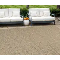 Photo of Beige and Brown Geometric Distressed Indoor Outdoor Area Rug