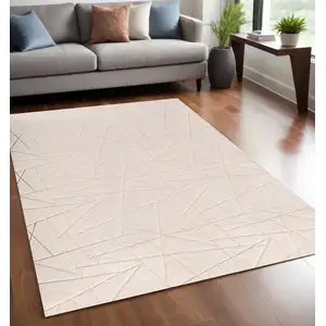 Photo of Beige and Gold Faux Fur Abstract Geometric Washable Non Skid Area Rug