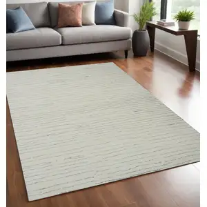 Photo of Beige and Gray Abstract Power Loom Distressed Area Rug