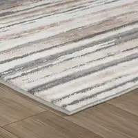 Photo of Beige and Gray Abstract Worn Faded Area Rug