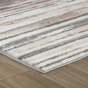 Photo of Beige and Gray Abstract Worn Faded Area Rug