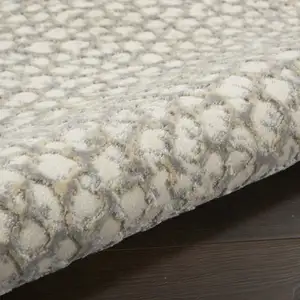 Photo of Beige and Gray Animal Print Power Loom Area Rug