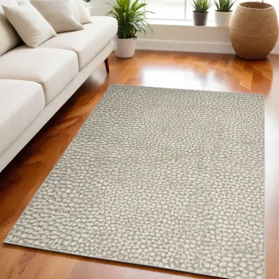 Beige and Gray Animal Print Power Loom Area Rug Photo 1