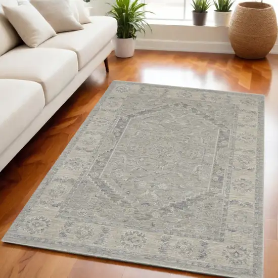 Beige and Gray Floral Medallion Power Loom Area Rug Photo 1