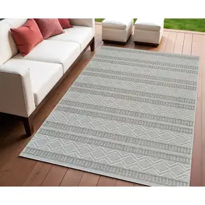 Photo of Beige and Gray Striped Distressed Indoor Outdoor Area Rug