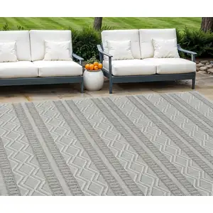 Photo of Beige and Gray Striped Distressed Indoor Outdoor Area Rug