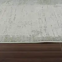 Photo of Beige and Green Abstract Distressed Area Rug