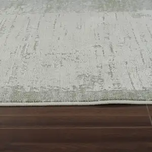 Photo of Beige and Green Abstract Distressed Area Rug