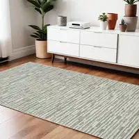 Photo of Beige and Green Abstract Distressed Area Rug