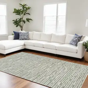 Photo of Beige and Green Abstract Distressed Area Rug