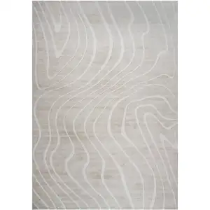 Photo of Beige and Ivory Abstract Distressed Area Rug