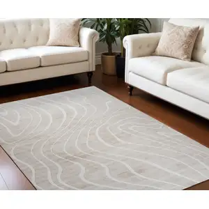 Photo of Beige and Ivory Abstract Distressed Area Rug