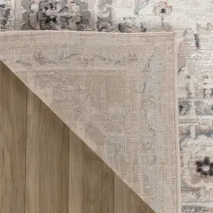 Photo of Beige and Ivory Abstract Distressed Area Rug