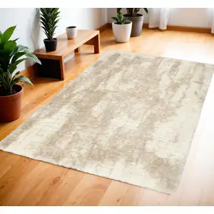 Photo of Beige and Ivory Abstract Shag Area Rug