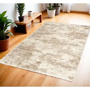 Photo of Beige and Ivory Abstract Shag Area Rug