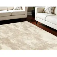 Photo of Beige and Ivory Abstract Shag Area Rug