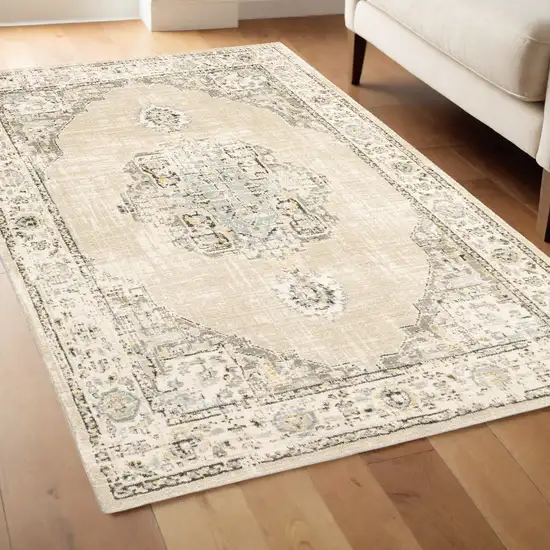 Beige And Ivory Center Jewel Area Rug Photo 1