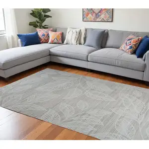 Photo of Beige and Ivory Floral Distressed Area Rug